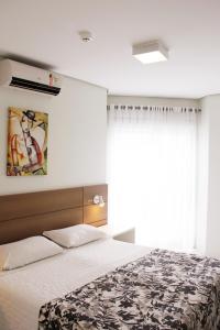 מיטה או מיטות בחדר ב-Hotel Porto Madero