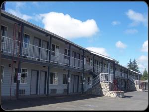 a building with balconies on the side of it at Pacific Inn Motel in Forks