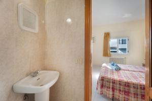 a bathroom with a sink and a bed at Hotel Germán in Vilaflor +47 photos