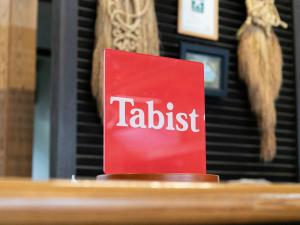 a red card with the word tablet on a table at Tabist Fontana no Oka Kamou in Aira