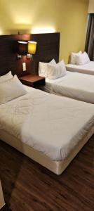 Ένα ή περισσότερα κρεβάτια σε δωμάτιο στο GR Suite SCSP