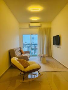 Μια τηλεόραση ή/και κέντρο ψυχαγωγίας στο homestay Alor Setar near Aman Centre-Condo Menara View by HogarFeliz