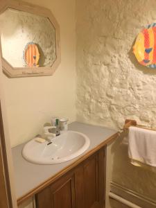 a bathroom with a sink and a mirror at Chez Janie Hirst - Chambres d'hôtes in Montboucher-sur-Jabron +31 photos
