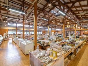 a store with a lot of tables in a room at Tabist Fontana no Oka Kamou in Aira +107 photos