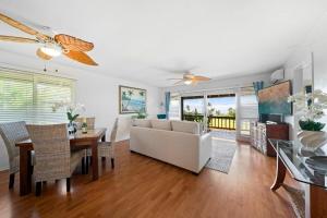 a living room with a couch and a table at Kaanapali Plantation 10 · KPL 10 Panoramic Ocean Views 2BD near in Lahaina
