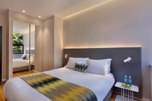 Postel nebo postele na pokoji v ubytování Ultra Tel Aviv Boutique Hotel