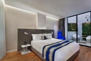 Postel nebo postele na pokoji v ubytování Ultra Tel Aviv Boutique Hotel