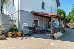 a building with an awning on the side of it at Schwalbenhof Dreßler und Duss für 4 Personen in Bad Herrenalb