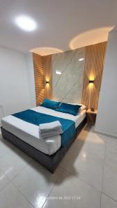 Krevet ili kreveti u jedinici u okviru objekta Apartasuite en Cartago +13 fotografija