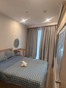 Ένα ή περισσότερα κρεβάτια σε δωμάτιο στο The Sóng Vũng Tàu Ocean Pearl Homestay