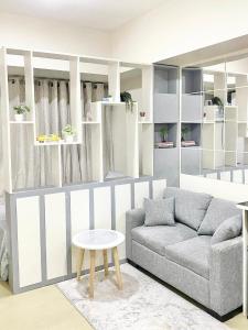 a living room with a couch and a table at Urban Oasis in Cagayan de Oro City in Cagayan de Oro