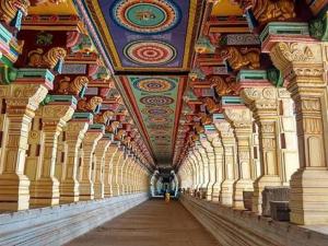 a long hallway of a building with a ceiling at smk mukil cottage in Rāmeswaram