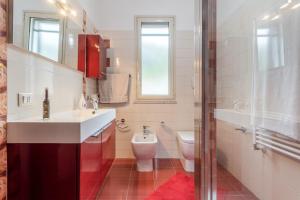a bathroom with a sink and a toilet at Casa splendida in Monreale +21 photos