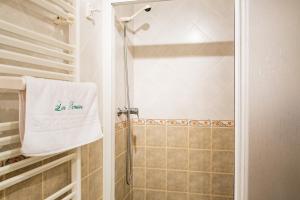 a bathroom with a shower with a white towel at Las Puentes 1 in Candelario +19 photos