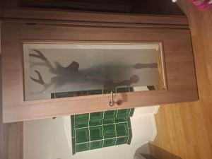 a window in a room with green tiles on the wall at Wohnung Aussicht in Wald