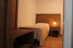 Postel nebo postele na pokoji v ubytování Agriturismo L'Ulivo