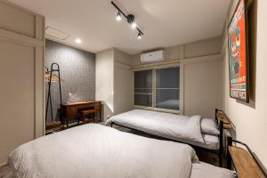 Ένα ή περισσότερα κρεβάτια σε δωμάτιο στο izu high village