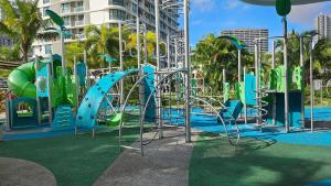 a playground with a slide in a park at Macrolink Medini Blossom Stay 2BR 4pax by Our Stay in Iskandar Puteri