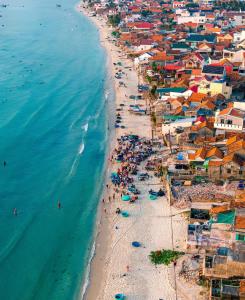 an aerial view of a beach with a crowd of people at Villa De Doc Let Homestay in Nha Trang