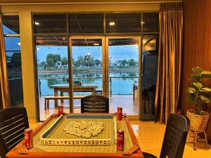 a room with a table with a chessboard on it at Entire Villa, Ferry Terminal Pickup & Breakfast in Batam Center