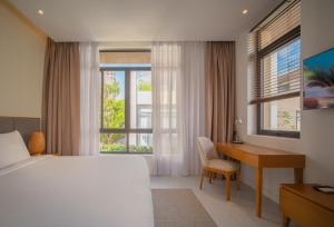 Postel nebo postele na pokoji v ubytování Cam Ranh Mystery Villas & Spa + 57 fotografií