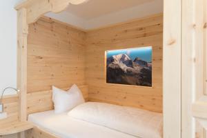a sauna in a wooden room with a mountain at Alpenblick Nr 2 in Campo Tures