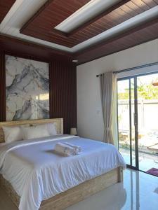 Ένα ή περισσότερα κρεβάτια σε δωμάτιο στο The Sundara Amed