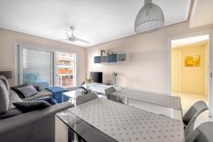 a living room with a couch and a table at Lopimar Exclusivo in Canet de Berenguer