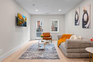 a living room with a couch and a table at Lux 1BD Apartment in Dupont Washington DC in Washington