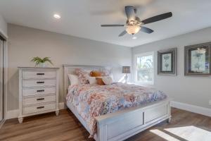 a bedroom with a bed and a ceiling fan at Destination #44 in Orange +42 photos