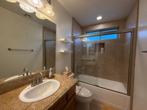 a bathroom with a sink and a shower at Joshua Tree Luxury Stay 5 mins from park in Joshua Tree +21 photos
