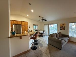a kitchen and living room with a couch and a table at Joshua Tree Luxury Stay 5 mins from park in Joshua Tree