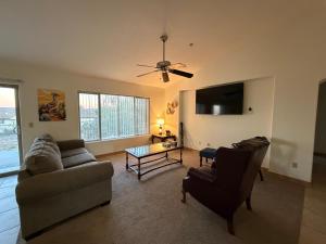 a living room with a couch and a table at Joshua Tree Luxury Stay 5 mins from park in Joshua Tree