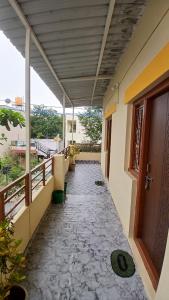a hallway of a house with a balcony at Shree krishna homestay in Hampi
