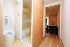 a bathroom with a toilet and a walk in shower at 中央公馆 Central Mansions 地下鉄谷町六丁目徒步1分心斎橋駅天王寺駅まで電車1本 in Osaka +95 photos