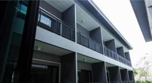 an external view of an apartment building with a balcony at Seven bee boutique hotel in Surin