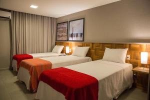Postel nebo postele na pokoji v ubytování Amenit Hotel