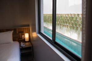 Postel nebo postele na pokoji v ubytování Amenit Hotel