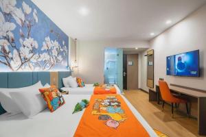 a bedroom with two beds and a desk and a tv at Magnotel Hotel Shanghai Railway Station Magnolia Plaza in Shanghai +233 photos