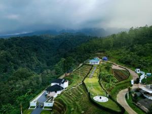 an aerial view of a mountain with houses and trees at Casa de Monique Villas & Glamping Retreat in Bogor