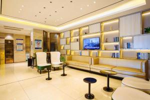 Una televisión o centro de entretenimiento en City Comfort Inn Taiyuan Xiaodian District Government Tongda Street Metro Station