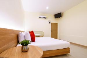 Postel nebo postele na pokoji v ubytování OK Resort Banchang