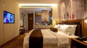 a bedroom with a large white bed with a mirror at James Joyce Coffetel· Wuhan Wangjiawan Taojialing Metro Station in Wuhan +16 photos