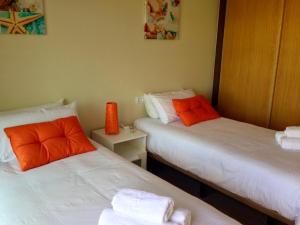 Łóżko lub łóżka w pokoju w obiekcie Aguarii Cotillo