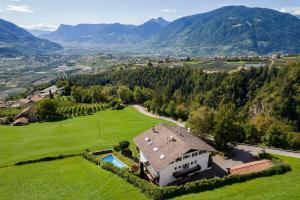 an aerial view of a house in the mountains at Apartment Belvedere in Caines