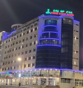 a building with blue lights on top of it at Debredamo Hotel in Addis Ababa