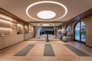 an office lobby with a large circular ceiling at Nous Land Beijing in Beijing