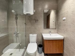 a bathroom with a toilet and a sink and a shower at 利恩之家 Maison Lienne in Cairo