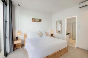 Postel nebo postele na pokoji v ubytování Moon Light Villa + 20 fotografií