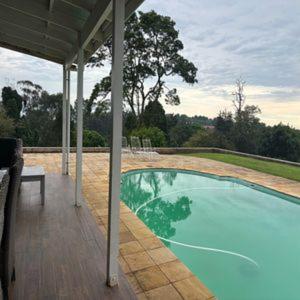 a swimming pool on a porch of a house at Hilton Farm Charm in Hilton